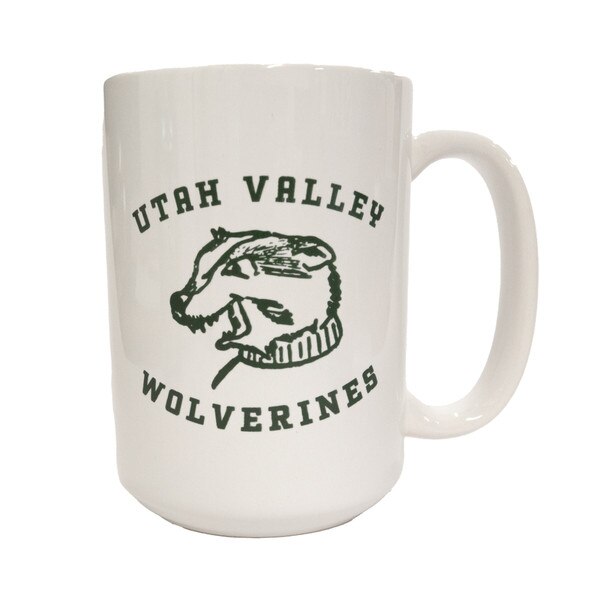 White mug with one of the first iterations of the mascot head logo on the front with “Utah Valley University” surrounding it